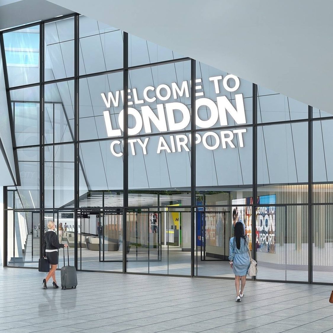 Modern airport entrance with large glass panels and "Welcome to London City Airport" signage.